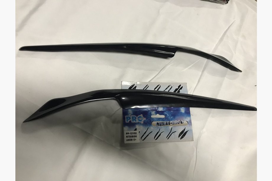 Mitsubishi Lancer X 2008- Pestañas para faros (2 uds, imprimadas) Image