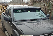 Nissan Navara 2006-2015 Visera para parabrisas (en el marco) foto 1