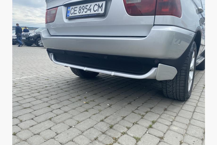 BMW X5 E53 1999–2006 Cubierta de parachoques trasero (imprimada para pintar) Image