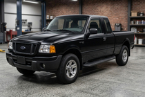 Ford Ranger 2002-2006 Estribos Laterales Tayga Black (2 uds., Aluminio) foto 1